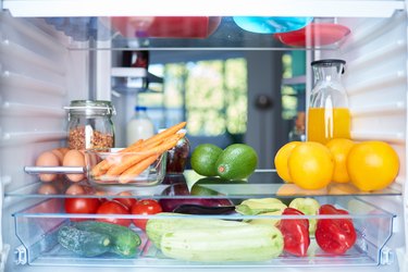 Interior of refrigerator with food on shelves