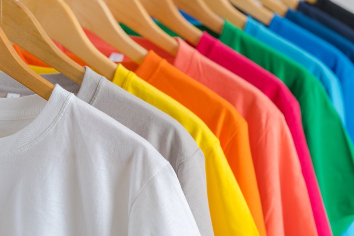 Colorful T-shirts on hangers