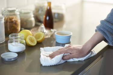 Cleaning kitchen with natural cleaning products.