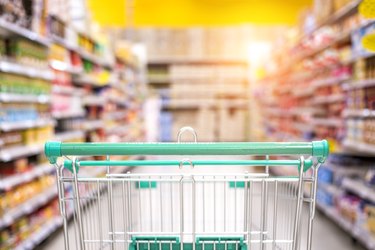 Empty shopping cart in the supermarket shopping mall