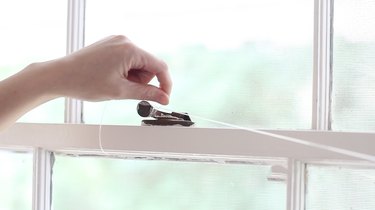 Tying fishing line to window lock