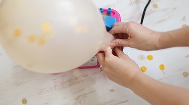 blowing up balloon