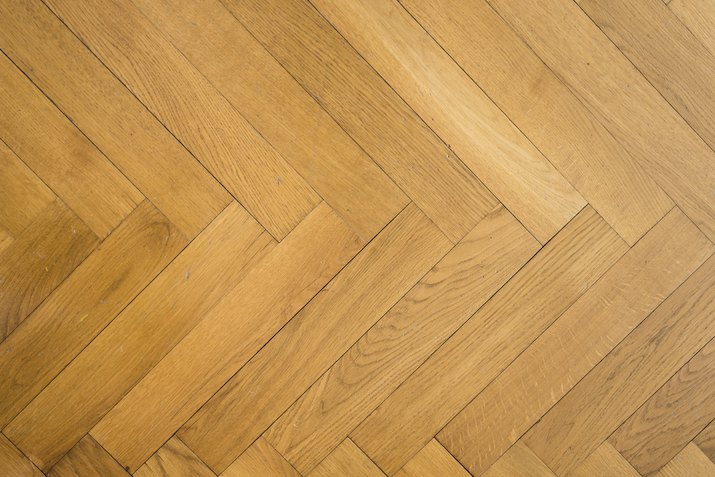 herringbone pattern on old oak parquet hardwood floor