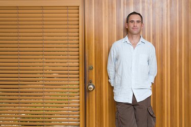 Man leaning on front door