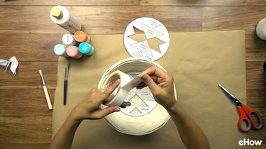 Attaching stencil to basket for DIY desert-style baskets.