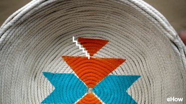 Creating faux woven effect on DIY desert-style baskets.