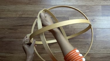 Assembling DIY orb pendant light using embroidery or quilting hoops