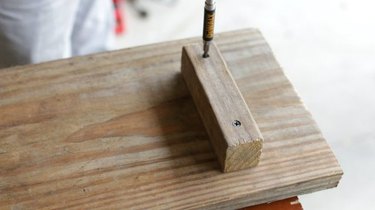 Screwing feet on the wooden bath caddy