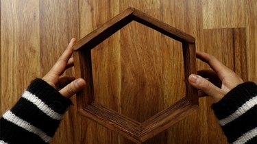 Basic DIY hexagon shelf made from popsicle sticks.