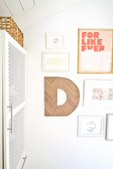 Herringbone letter hanging in gallery wall