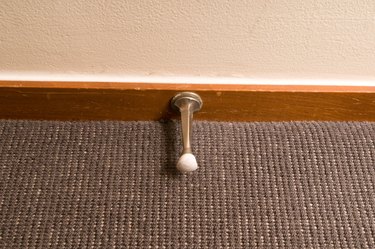 Spring doorstop in hotel room