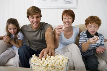 Family eating popcorn