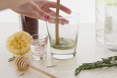 Woman making cocktail