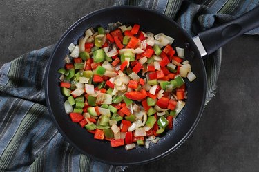 Cook onions and peppers