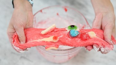 Stretching edible slime with body parts