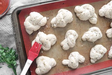 Brush knots with garlic butter