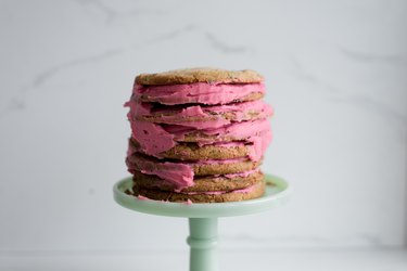 Continue to repeat the layering the process to form a cookie cake that's 8 layers high.