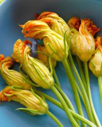 Trim the stems of zucchini flowers to about half an inch before cooking.